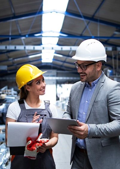 IRC engineers reviewing an inspection report on a tablet